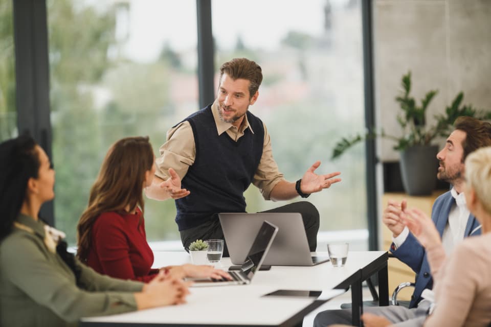 Operations team planning a program together in a meeting room