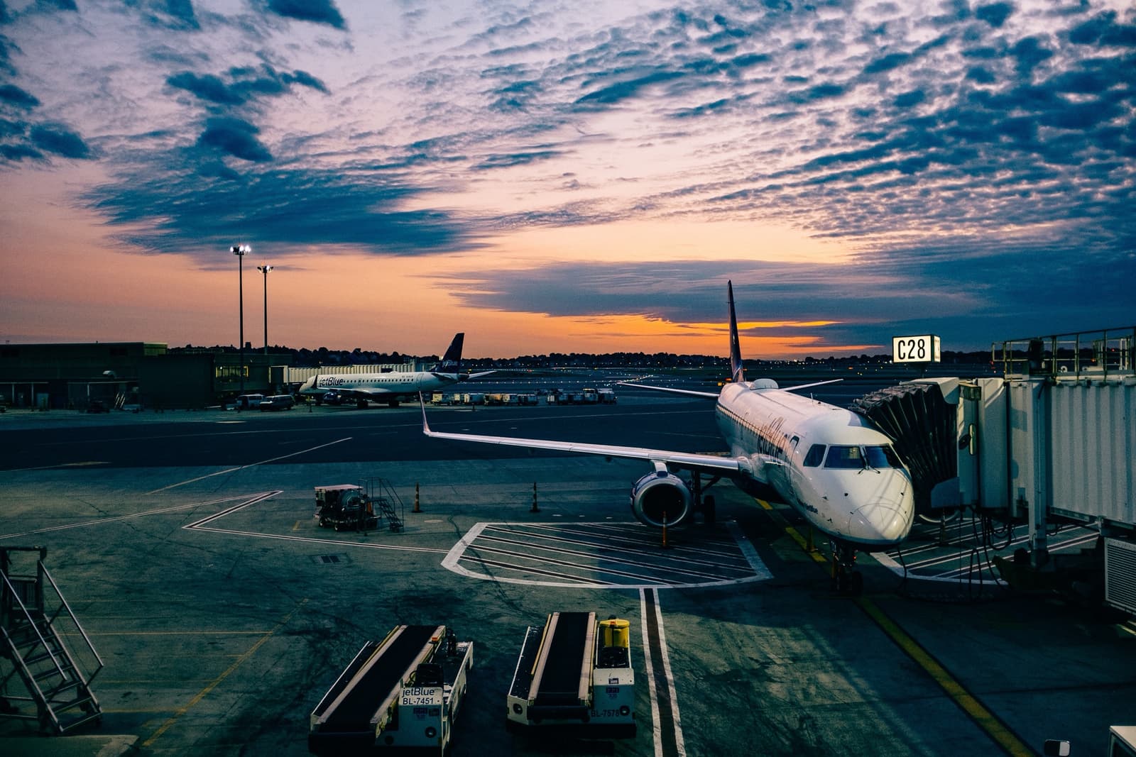 Aircraft at the gate at sunset, representing airline customer operations